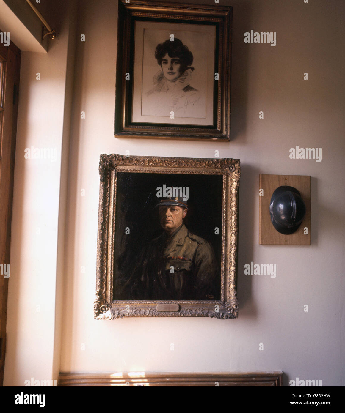 Portrait of Sir Winston Churchill in French uniform, by Sir John Lavery, with the actual helmet hung up next to it at Chartwell Manor in Westerham, Kent, former home of the late Winston Churchill. The house will be open to the public as of June 21st 1966. Stock Photo