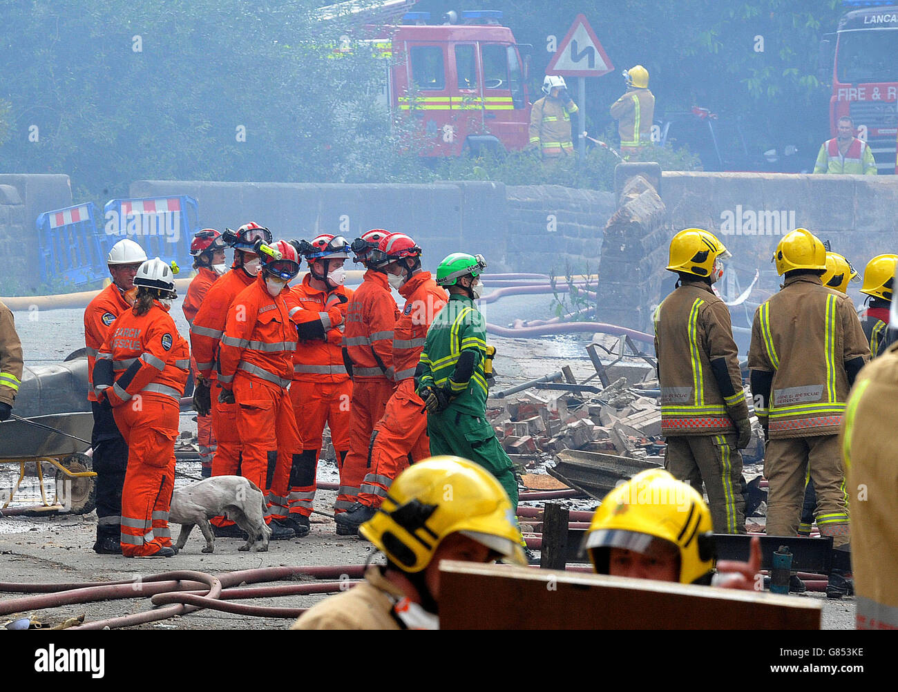 Search and rescue teams from all emergency services search the scene of an explosion and fire where four people are still missing at Wood Flour Mills, Bosley, Cheshire. Stock Photo
