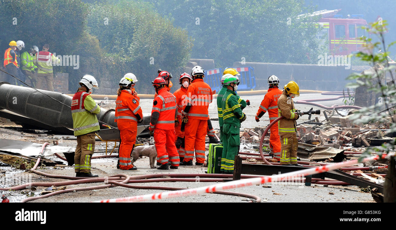 Search and rescue teams from all emergency services search the scene of an explosion and fire where four people are still missing at Wood Flour Mills, Bosley, Cheshire. Stock Photo