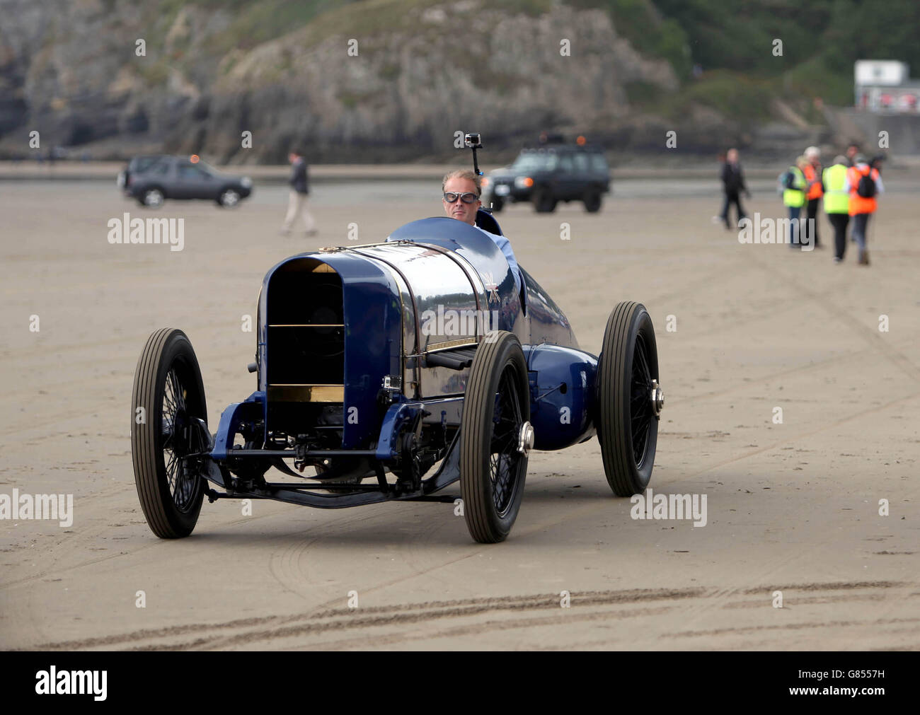 Sir Malcom Campbell's grandson Don Wales drives his grandfather's historic Sunbeam car nicknamed Bluebird on Pendine sands in Wales where the vehicle reached 150mph ago today. PRESS ASSOCIATION Photo. Picture date: Tuesday July 21, 2015. To mark the occasion, Don made a low-speed run in the vehicle. Photo credit should read: Steve Parsons/PA Wire Stock Photo