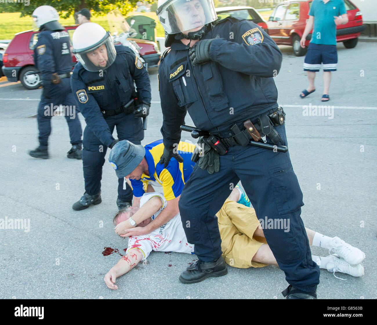 Austrian Police with supporters following violence after pre-season friendly involving Leeds United and Eintracht Frankfurt in the Austrian town of Eugendorf. Stock Photo