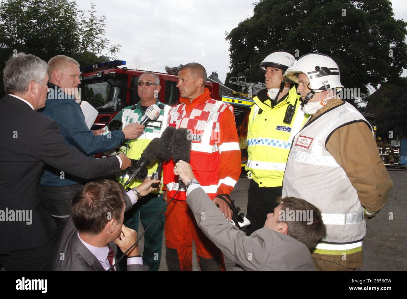 (Left - right) Ambulance Bronze Commander Steve Hallmark, Urban Search and Rescue Technical Advisor Paul Hitchen, Cheshire Constabulary Commander at the scene Peter Crowcroft and Cheshire Fire Service incident commander Andy Royle speak to the media at the scene of the huge explosion at Wood Treatment Limited plant in the village of Bosley, Cheshire. Stock Photo