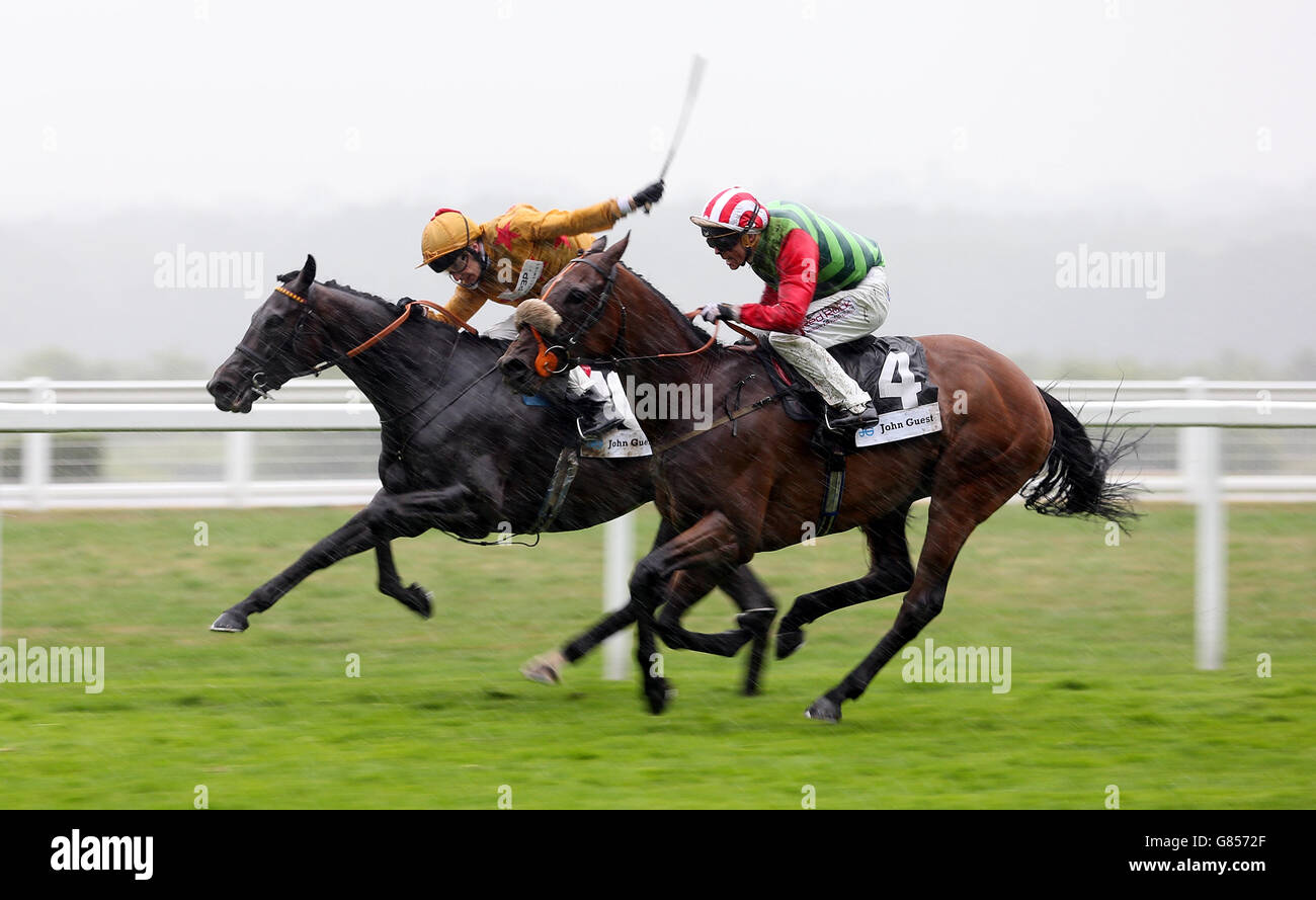 Eventual winner Seamour ridden by Ben Curtis (right) gets up to beat High Secret ridden by Luke Morris in the John Guest Brown Jack Stakes during day one of the King George Weekend at Ascot Racecourse. Stock Photo