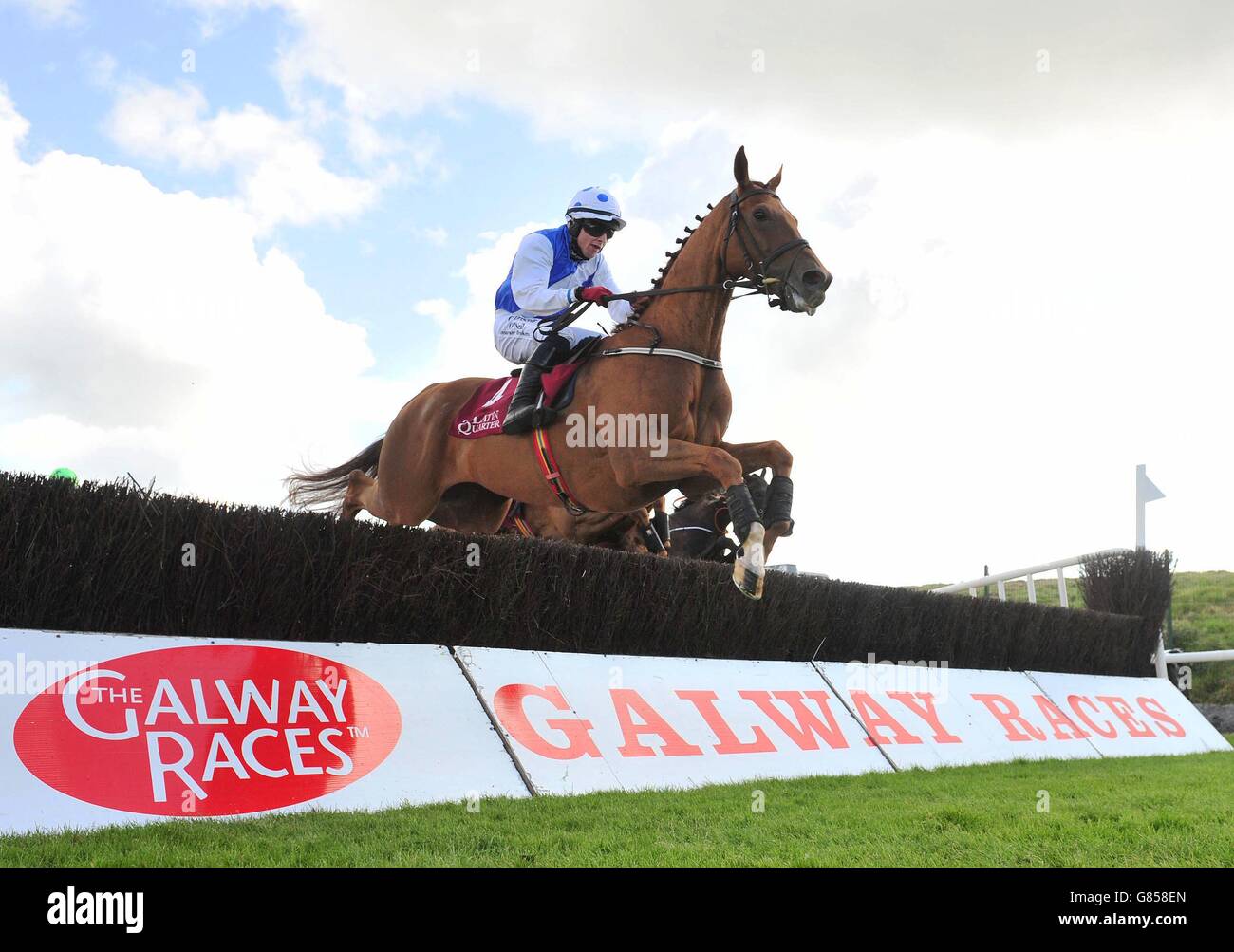 Empresario ridden by Mark Enright before winning the Latin Quarter Beginners Chase during day two of the Galway Festival at Galway Racecourse, Ballybrit. Stock Photo