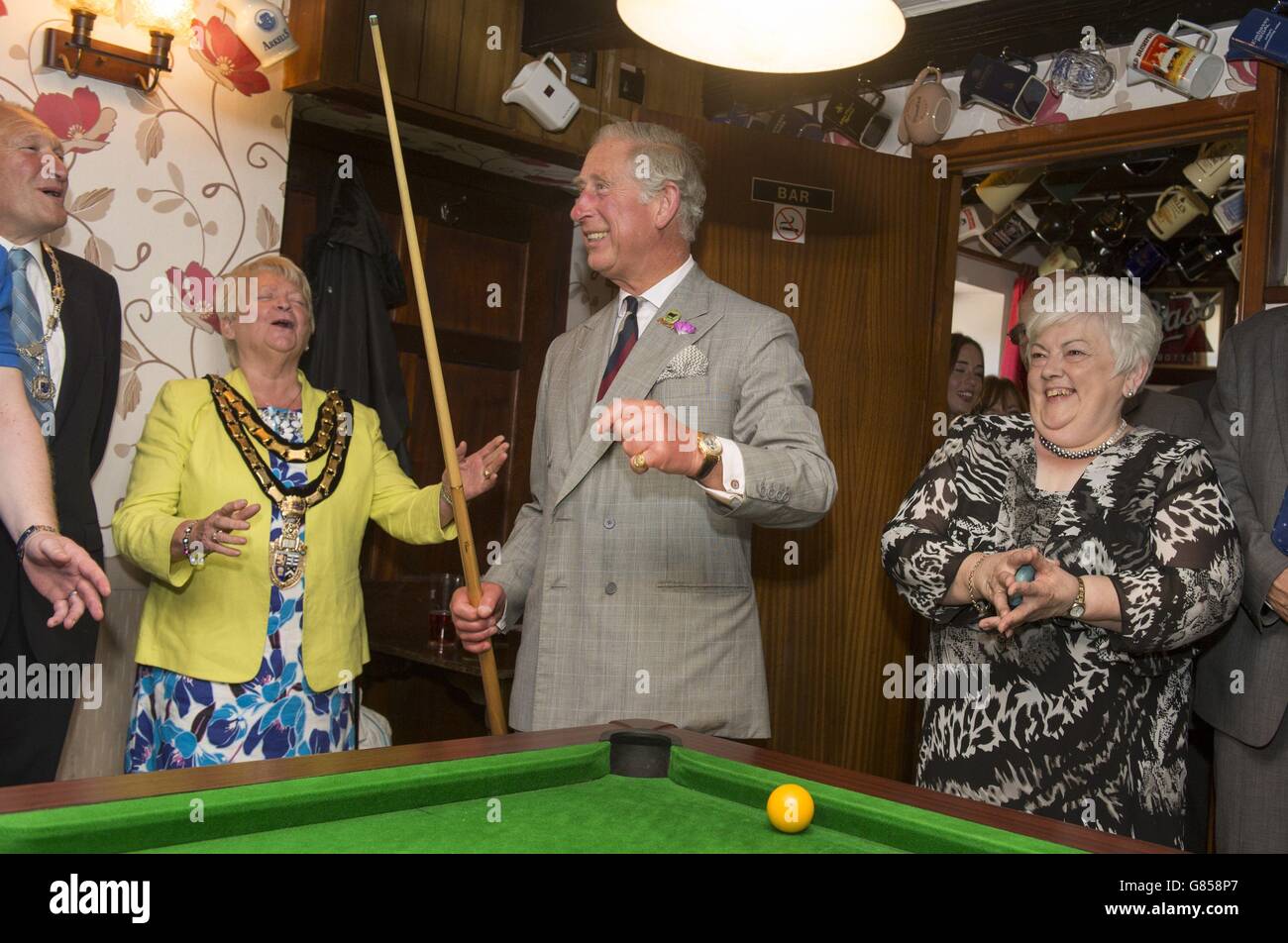 The Prince of Wales tries his hand at pool during his visit to The Glan yr Afon Arms in Talgarreg, Llandysul, which is supported by The Prince's Pub is the Hub initiative on the last day of his week long visit to Wales. Stock Photo