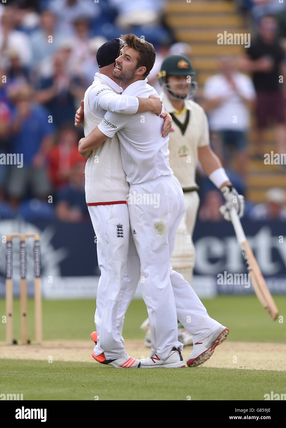 England's Mark Wood celebrates taking the wicket of Australia's Shane Watson during the First Investec Ashes Test at the SWALEC Stadium, Cardiff. Stock Photo