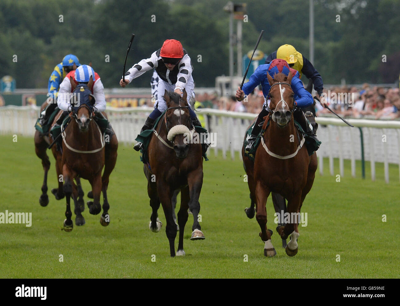 Master Carpenter ridden by Phillip Makin (right) wins the 56th John Smith's Cup day two of the John Smith's Cup Meeting at York Racecourse. Stock Photo