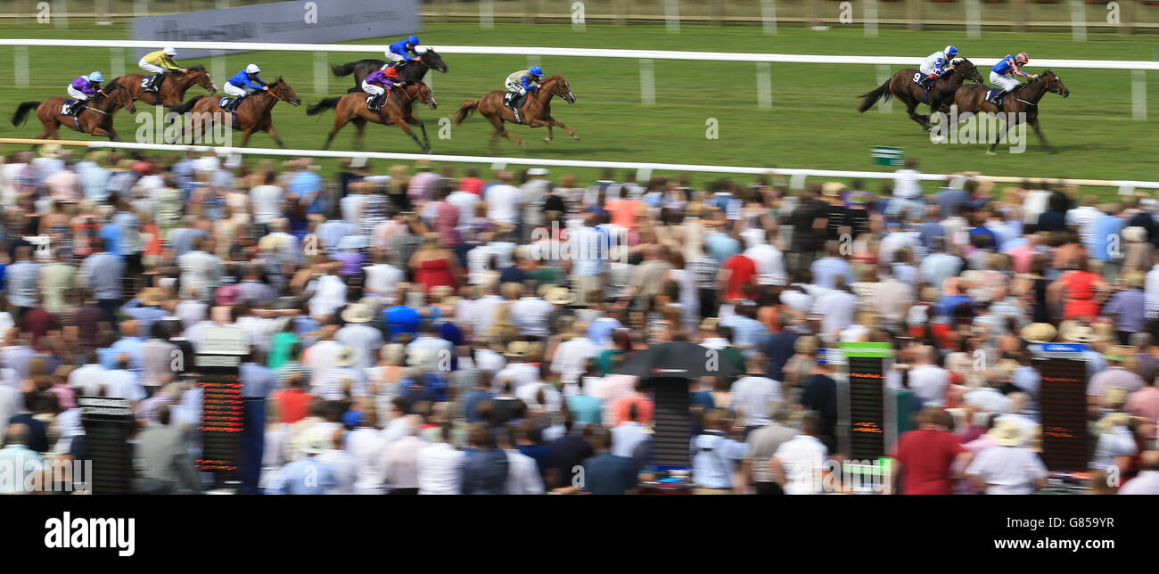 Ballydoyle (right) ridden by Joseph O'Brien wins The Rossdales EBF Stallions Maiden Stakes during day three of the July Festival at Newmarket Racecourse. Stock Photo