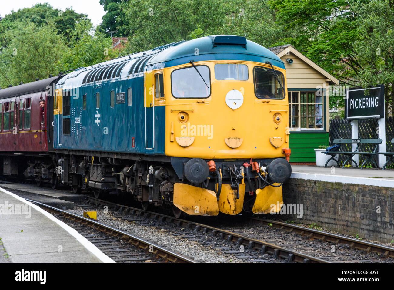 Class 26 diesel loco 26038 heading a passenger train entering Pickering station on the North Yorks Moors Railway Stock Photo