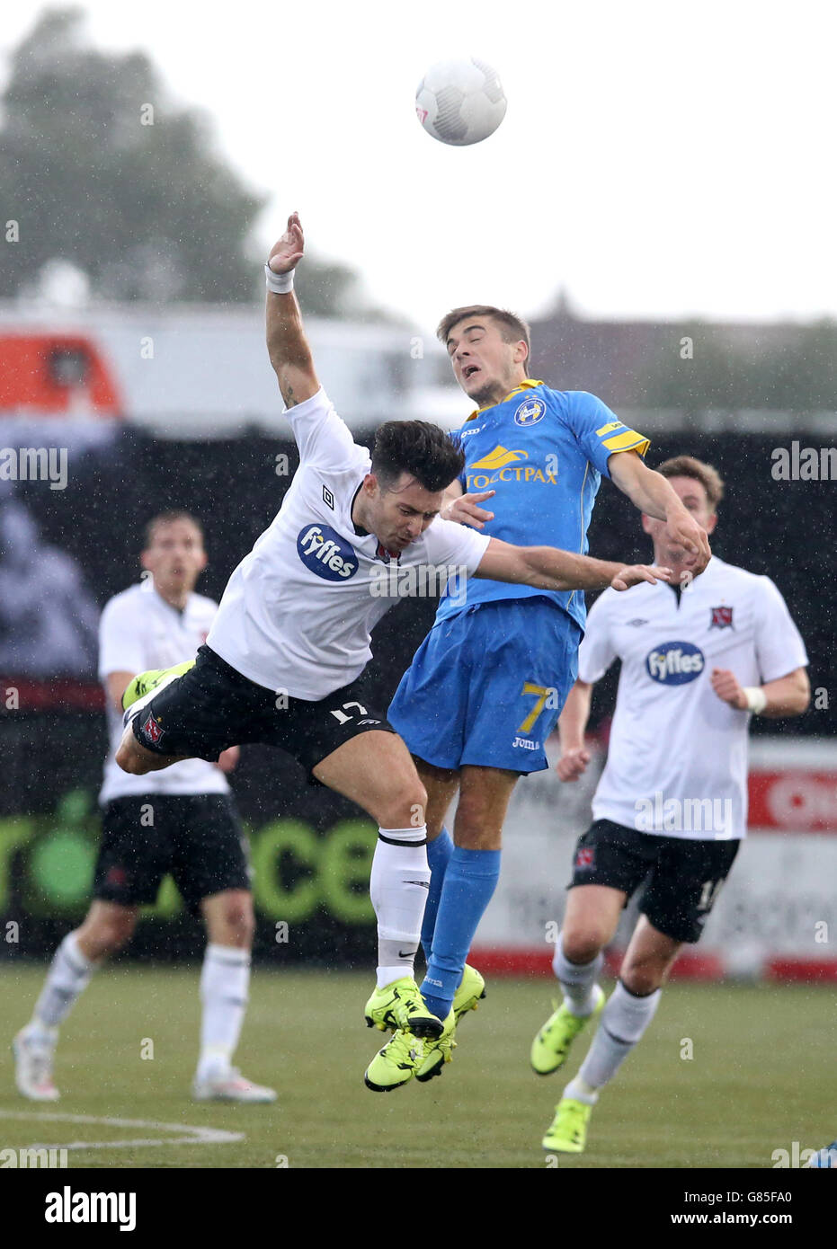 Dundalk's Richie Towell (left) and BATE Borisov's Aliaksandr Karnitski battle for the ball in the air during the UEFA Champions League Second Qualifying Round, Second Leg, at Oriel Park, Dundalk. Stock Photo