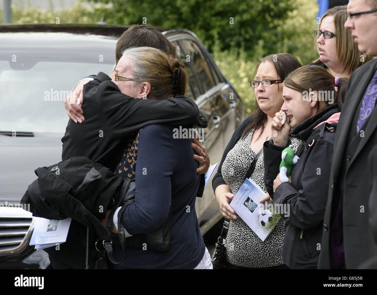 Mourners attend the funeral of John Yuill at St Francis Xavier's RC Church in Falkirk, Scotland