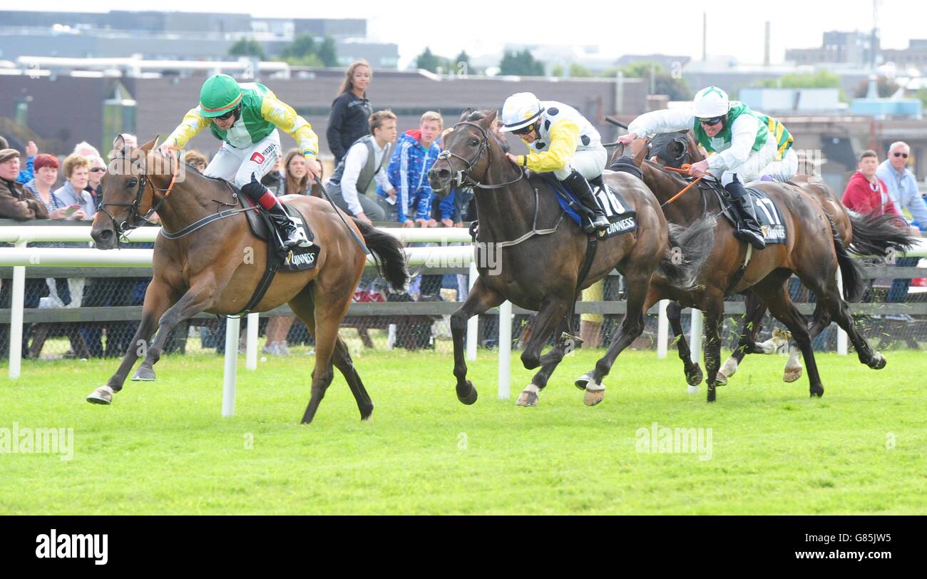 Bog War ridden by Leigh Roche (left) beats Swamp Fox (centre) to win the Guinness 50th Anniversary Handicap during day four of the Galway Festival at Galway Racecourse, Ballybrit. Stock Photo
