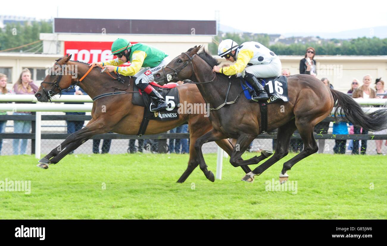Bog War ridden by Leigh Roche (left) beats Swamp Fox to win the Guinness 50th Anniversary Handicap during day four of the Galway Festival at Galway Racecourse, Ballybrit. Stock Photo