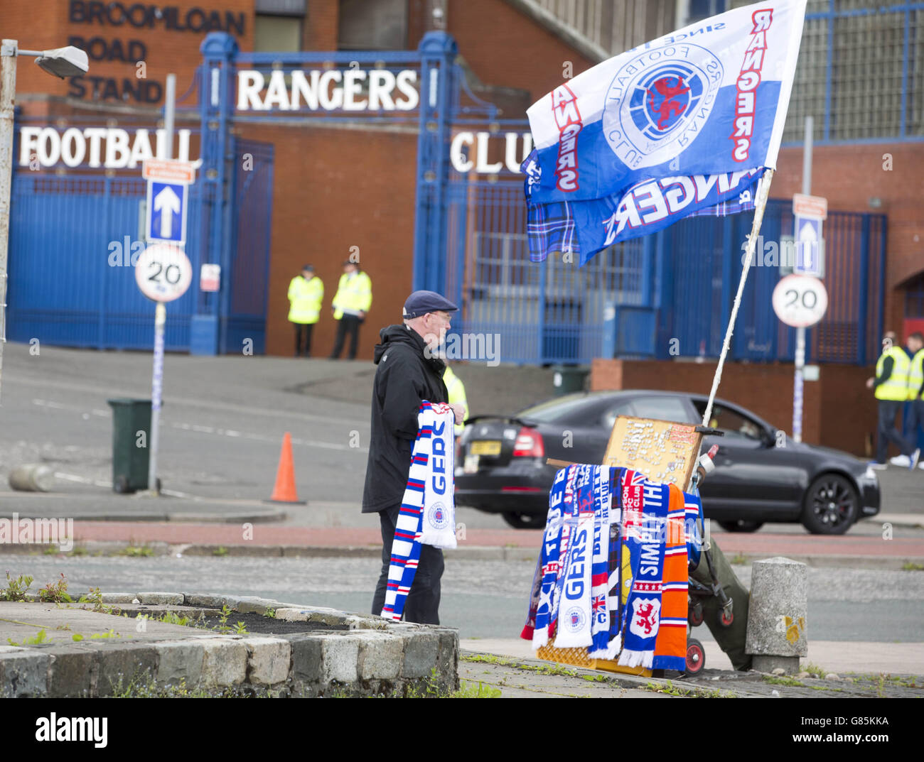 A Flag seller outside the ground before the Scottish Communities League Cup match at Ibrox Stadium, Glasgow. Stock Photo