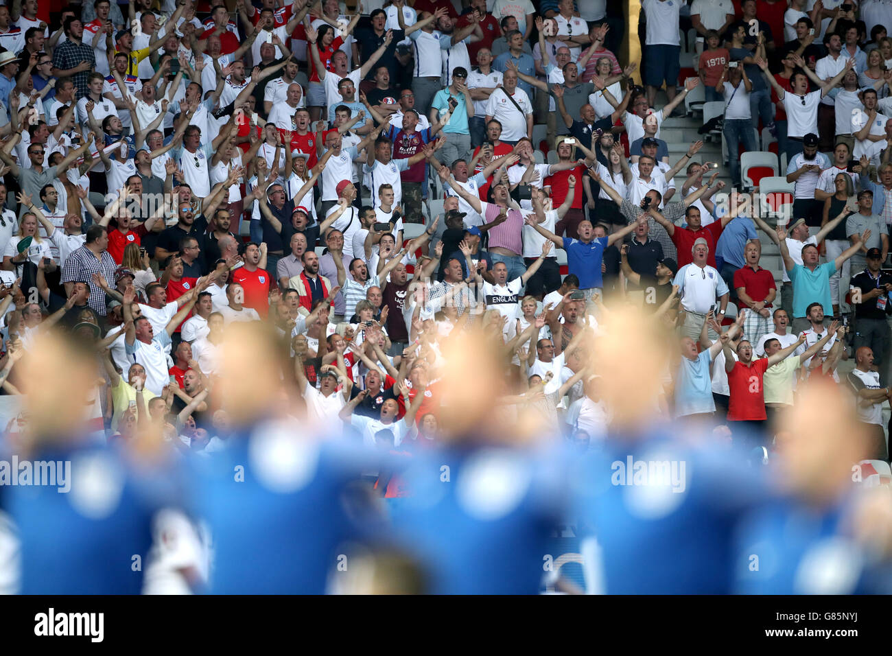 England fans sing the national anthem in the stands during the Round of