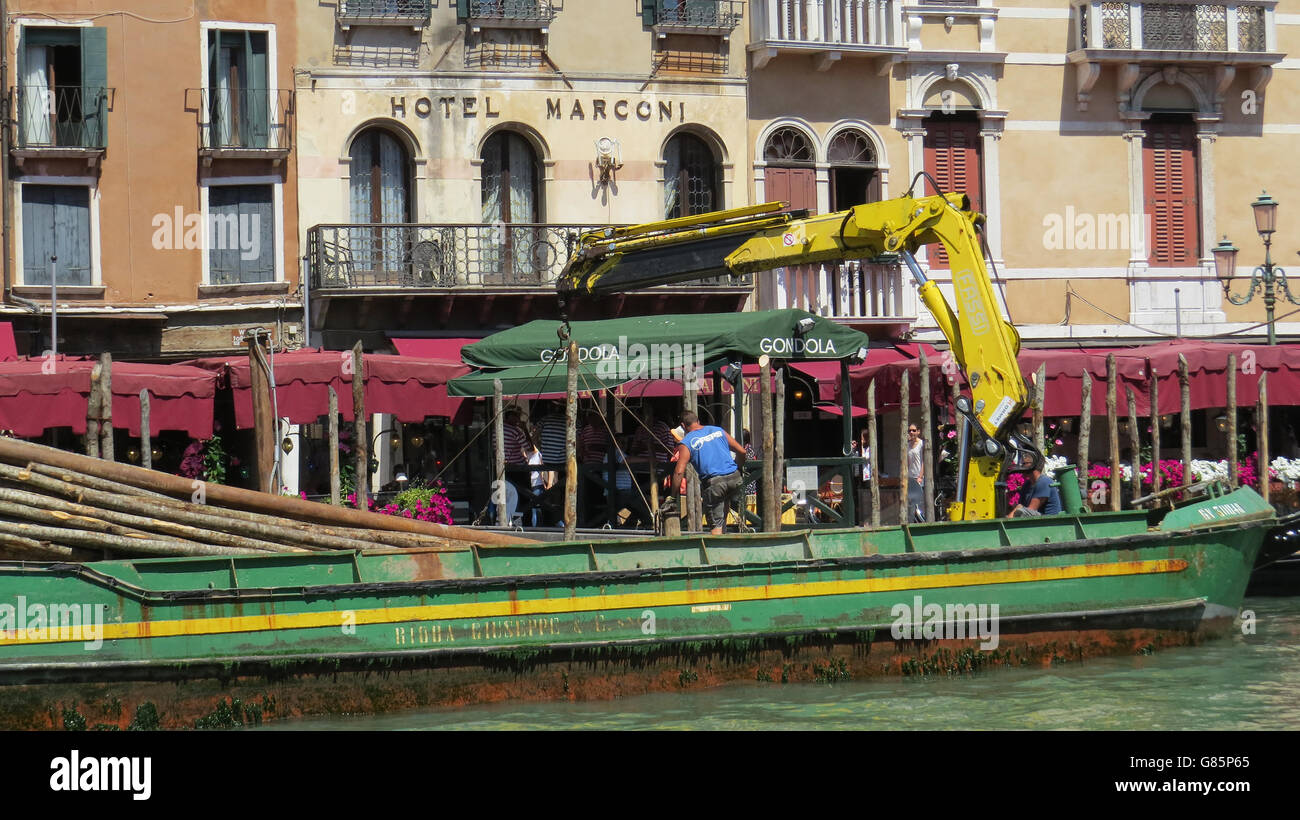 VENICE, Italy. Sinking new gondola poles on the Grand Canal. Photo Tony Gale Stock Photo