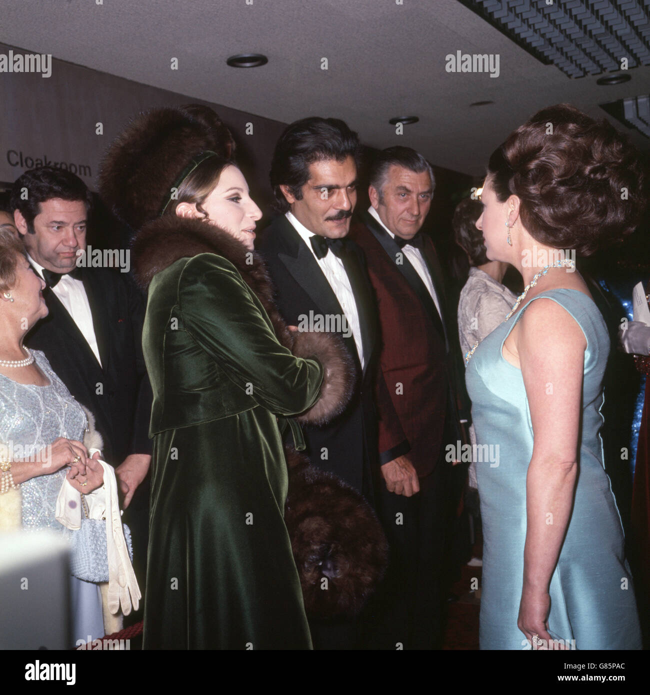 Princess Margaret talks with American actress Barbra Streisand (l) and Egyptian actor Omar Sharif (c) at the Royal Premiere of the film they are both appearing in 'Funny Girl' being held at the Odeon Theatre, Leicester Square, London. Stock Photo