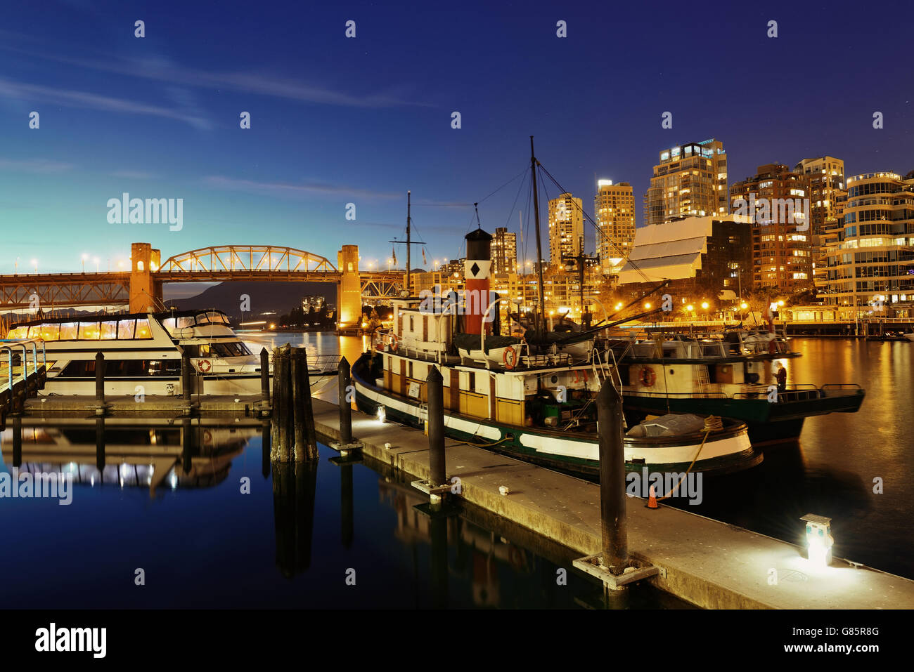 Vancouver False Creek at night with bridge and boat Stock Photo - Alamy