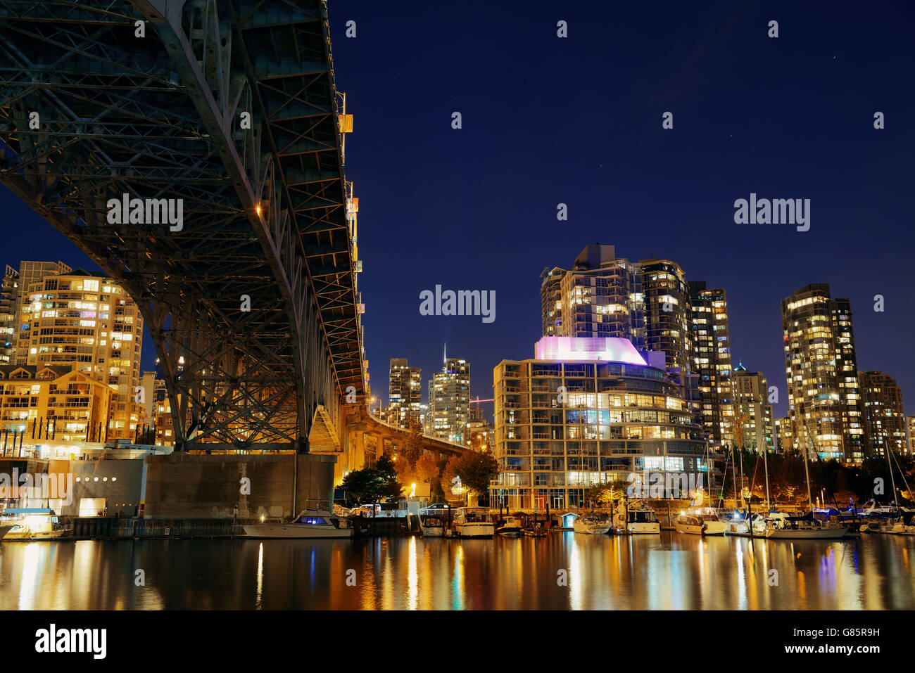 Vancouver False Creek at night with bridge and boat Stock Photo - Alamy