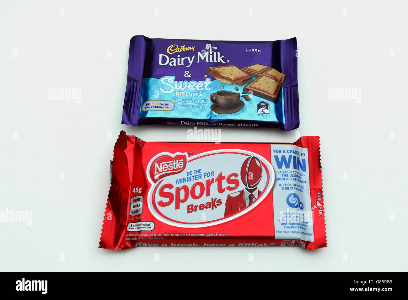 Cadbury Dairy Milk Sweet Biscuits and Kit Kat chocolate bar on white background Stock Photo