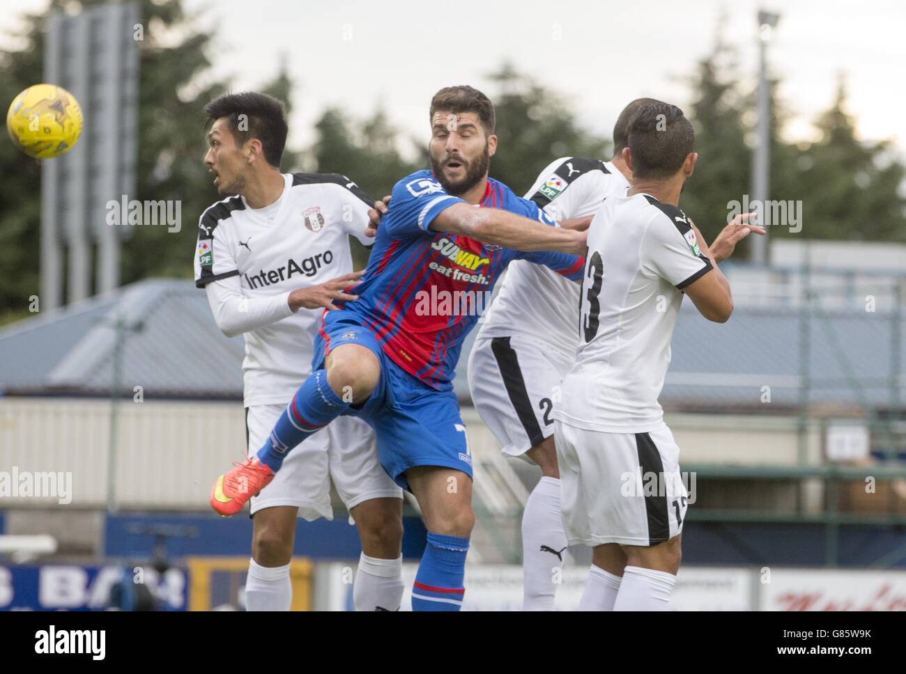 Inverness Caledonian Thistle's Dani Lopez (centre) takes on Astra Giurgiu's Takayuki Seto (left) and Junior Morais (right) during the Europa League Second Qualifying Round, First Leg, at Caledonian Stadium, Inverness, Scotland. PRESS ASSOCIATION Photo. Picture date: Thursday July 16, 2015. See PA story SOCCER Inverness. Photo credit should read: Jeff Holmes/PA Wire. Stock Photo