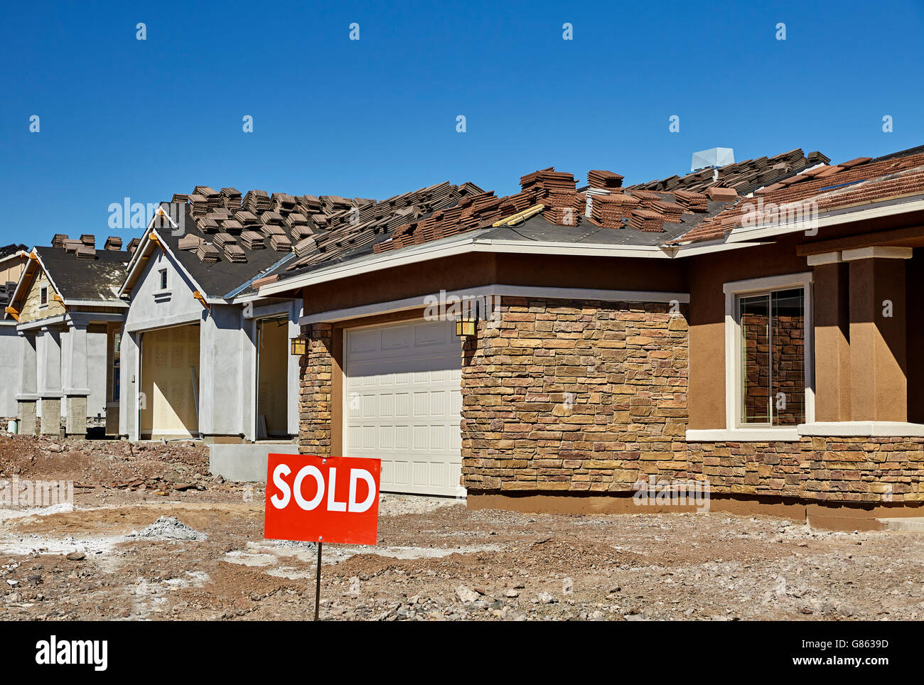 Construction industry new home for sale with sold sign Stock Photo Alamy