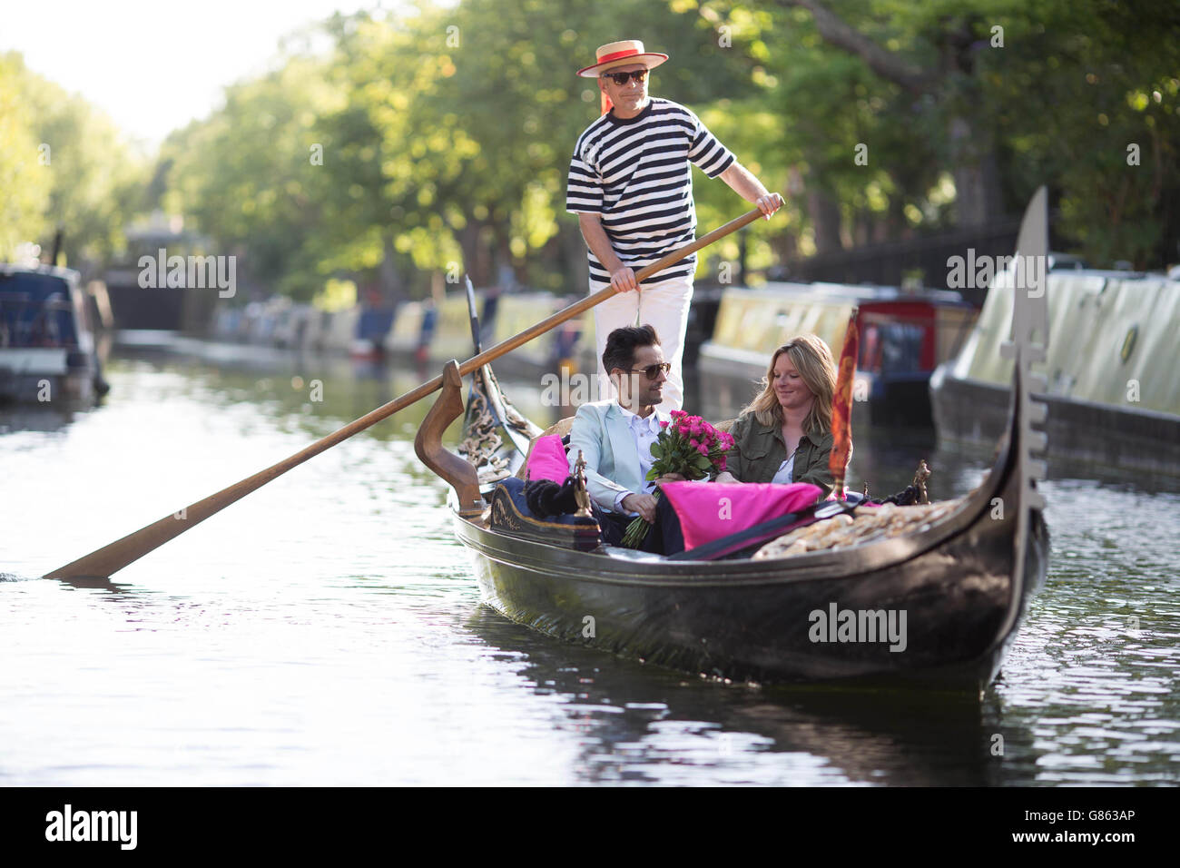 Chloe Robinson from London (right) flirts with Davide Infantino from Sicily to launch the lastminute.com School of Flirting, onboard a Gondola in London's Little Venice. Stock Photo