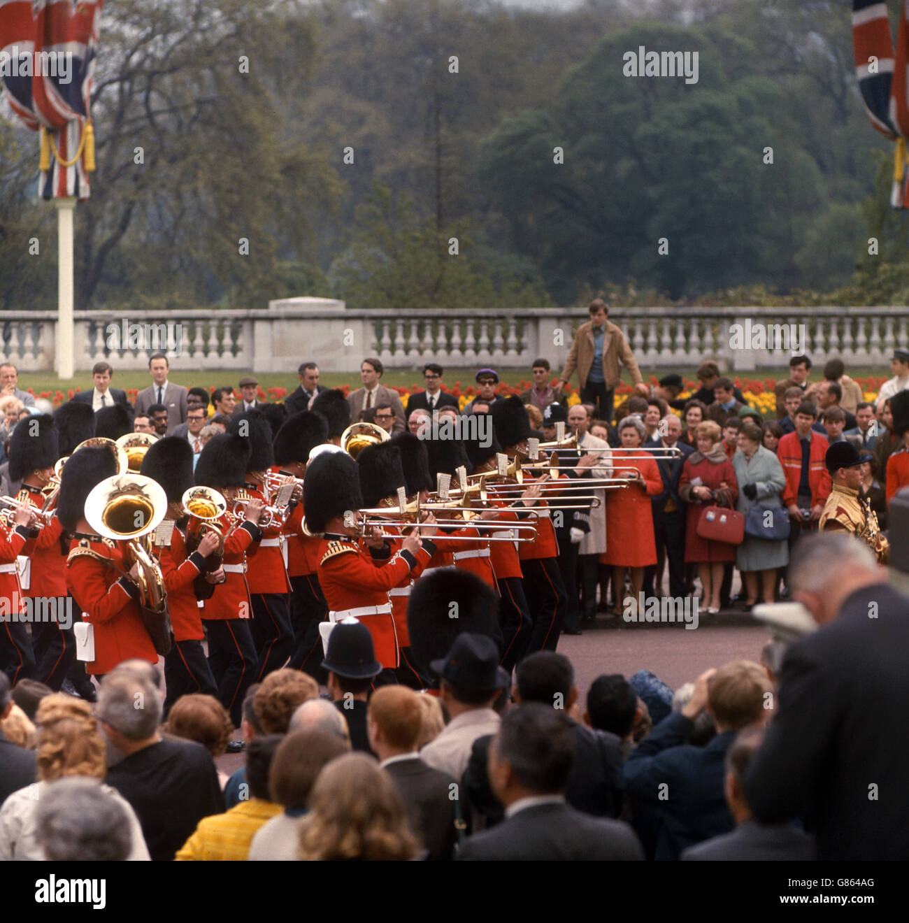 The Band of the Coldstream Guards heads the procession along the Mall, with Admiralty Arch in the background, towards Buckingham Palace on the first day of King Faisal of Saudi Arabia's State Visit. Stock Photo
