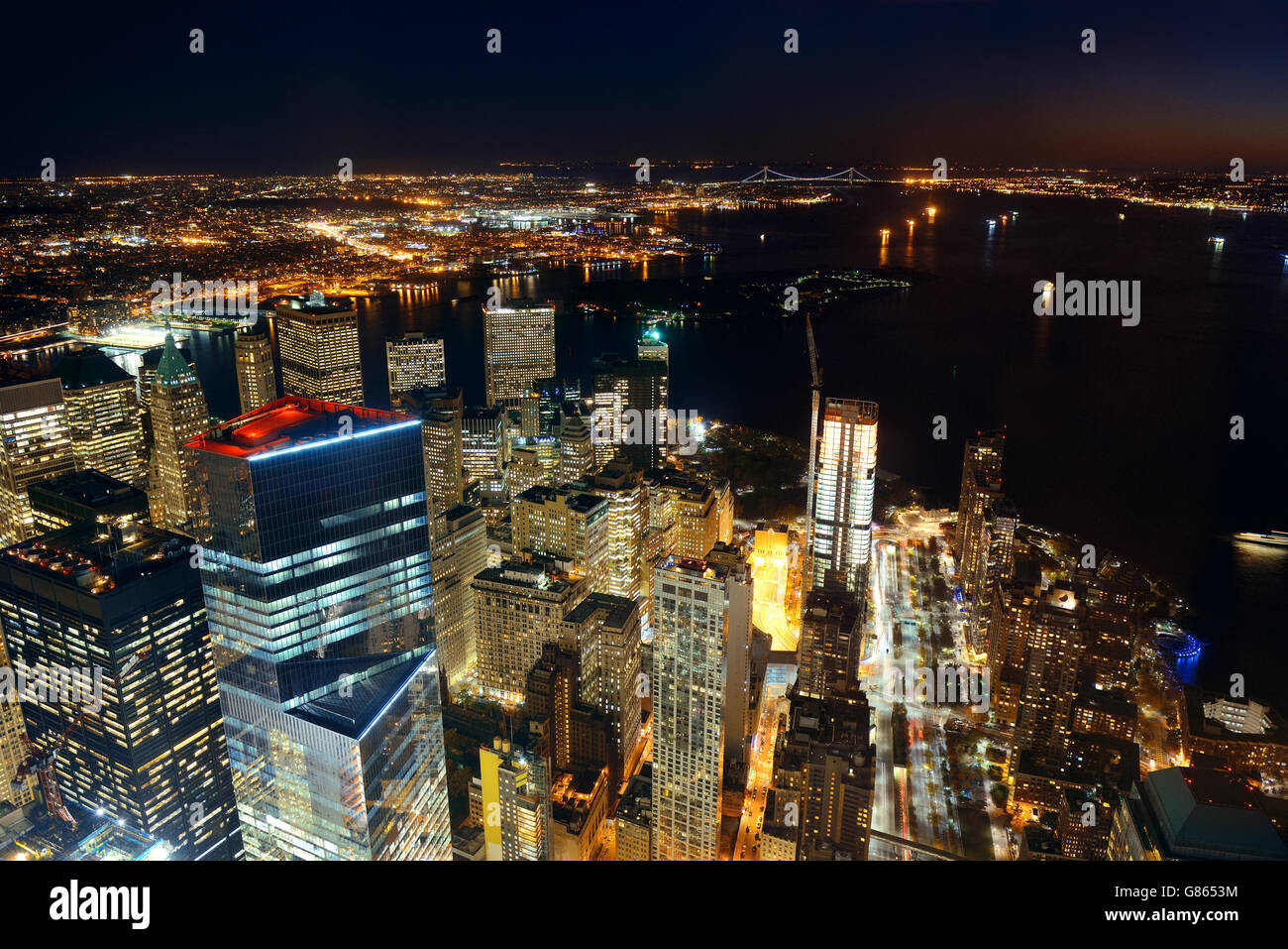 Rooftop night view of New York City downtown with urban skyscrapers ...