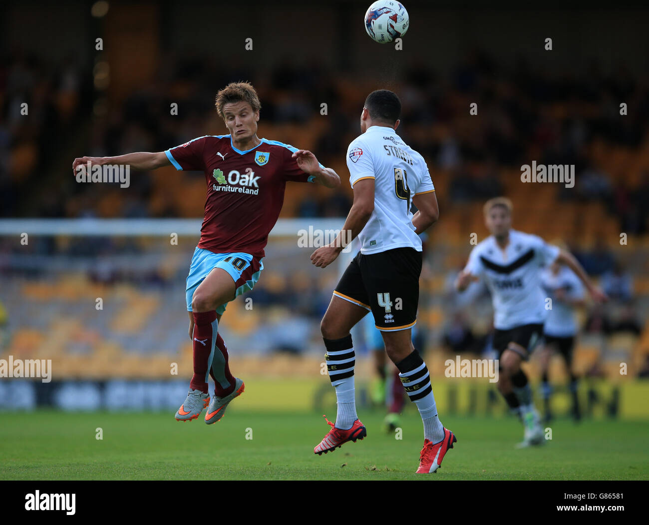 Burnley's Jelle Vossen challenges Port Vale's Remie Street (right) during the Capital One Cup, First Round match at Vale Park, Stoke-on-Trent. Stock Photo
