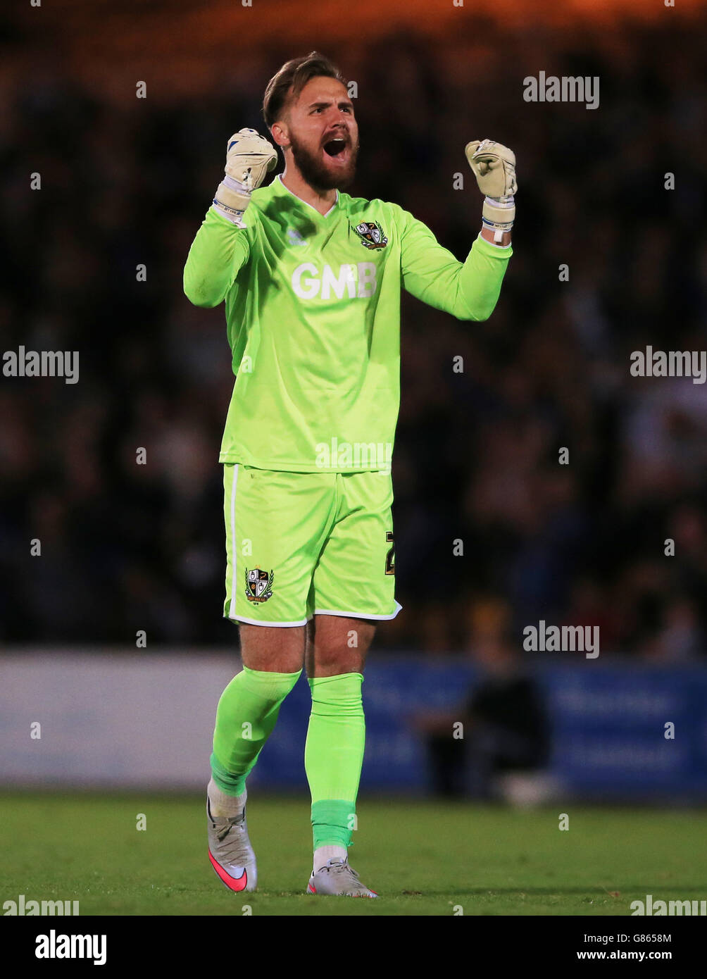 Port Vale goalkeeper Jak Alnwick celebrates his side's first goal of the game, during the Capital One Cup, First Round match at Vale Park, Stoke-on-Trent. Stock Photo