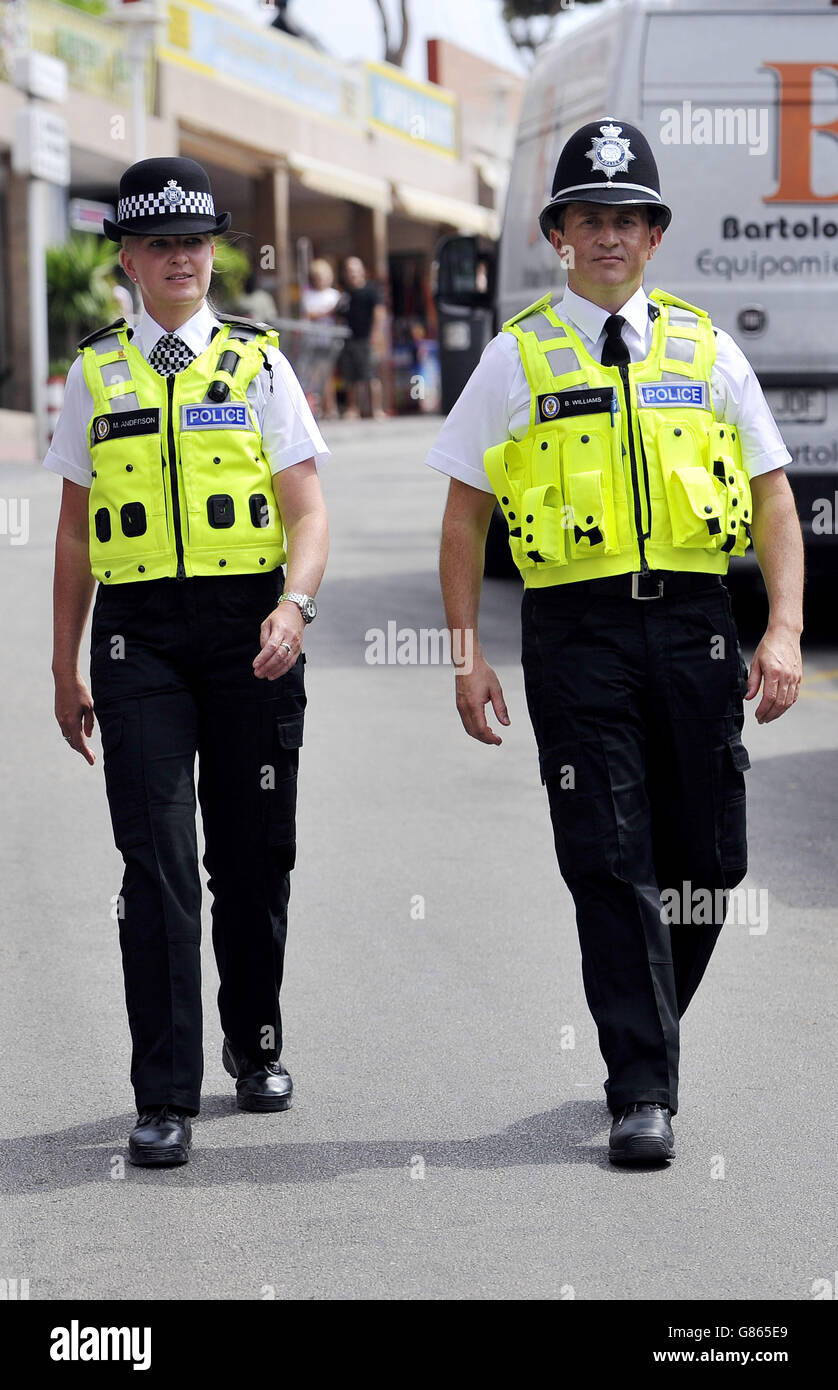 West Midlands Police officers, PC Martina Anderson and Sergeant Brett Williams,in Punta Ballena, the main club strip in Magaluf, Majorca, Spain, just after midday local time, prior to getting busy at night, have joined Spanish colleagues during a trial funded by the Foreign Office to patrol tourist hotspots including beaches, airport terminals and town centres. Stock Photo