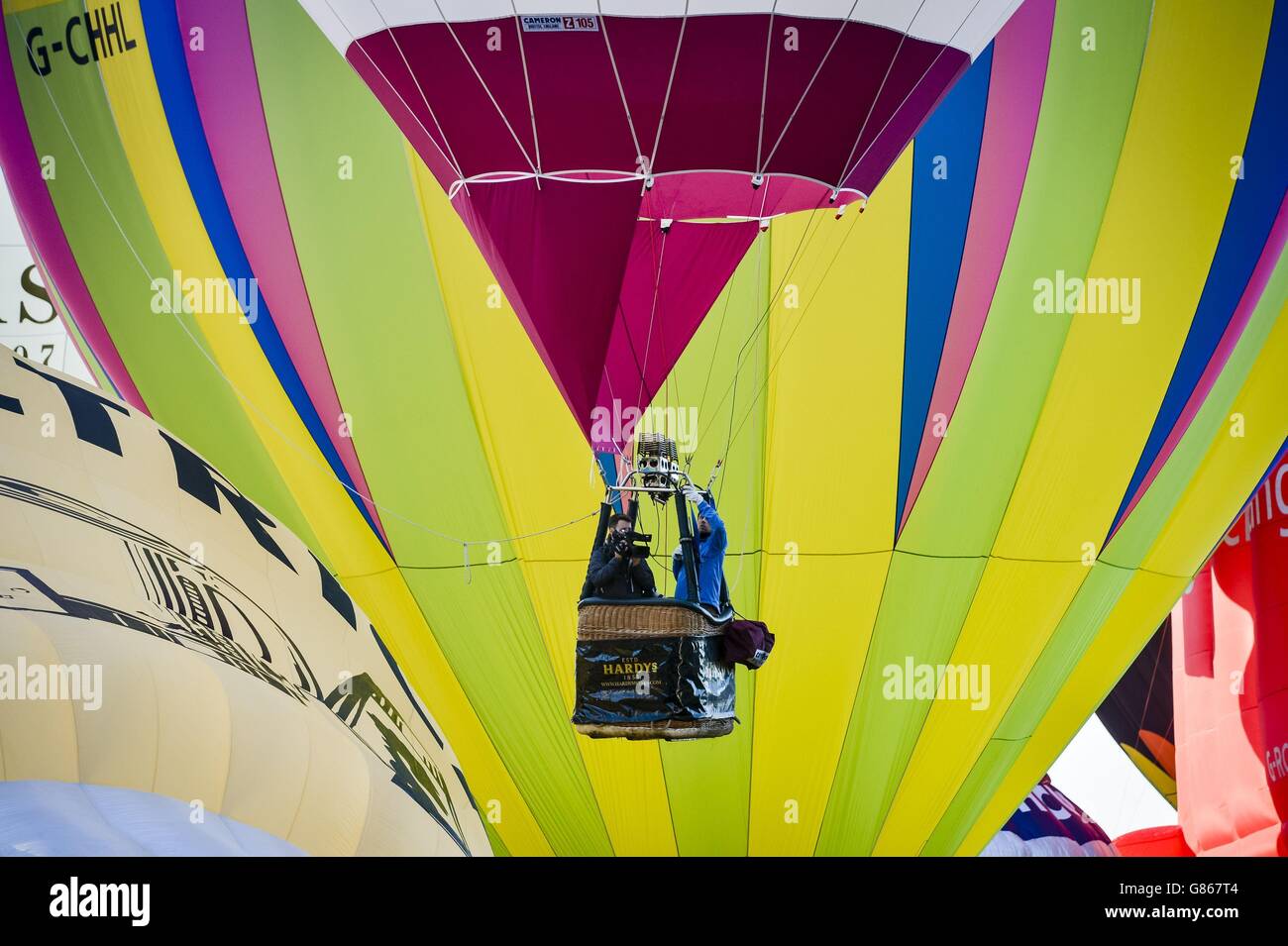 Hot air balloons lift off during the first mass ascent at the 37th