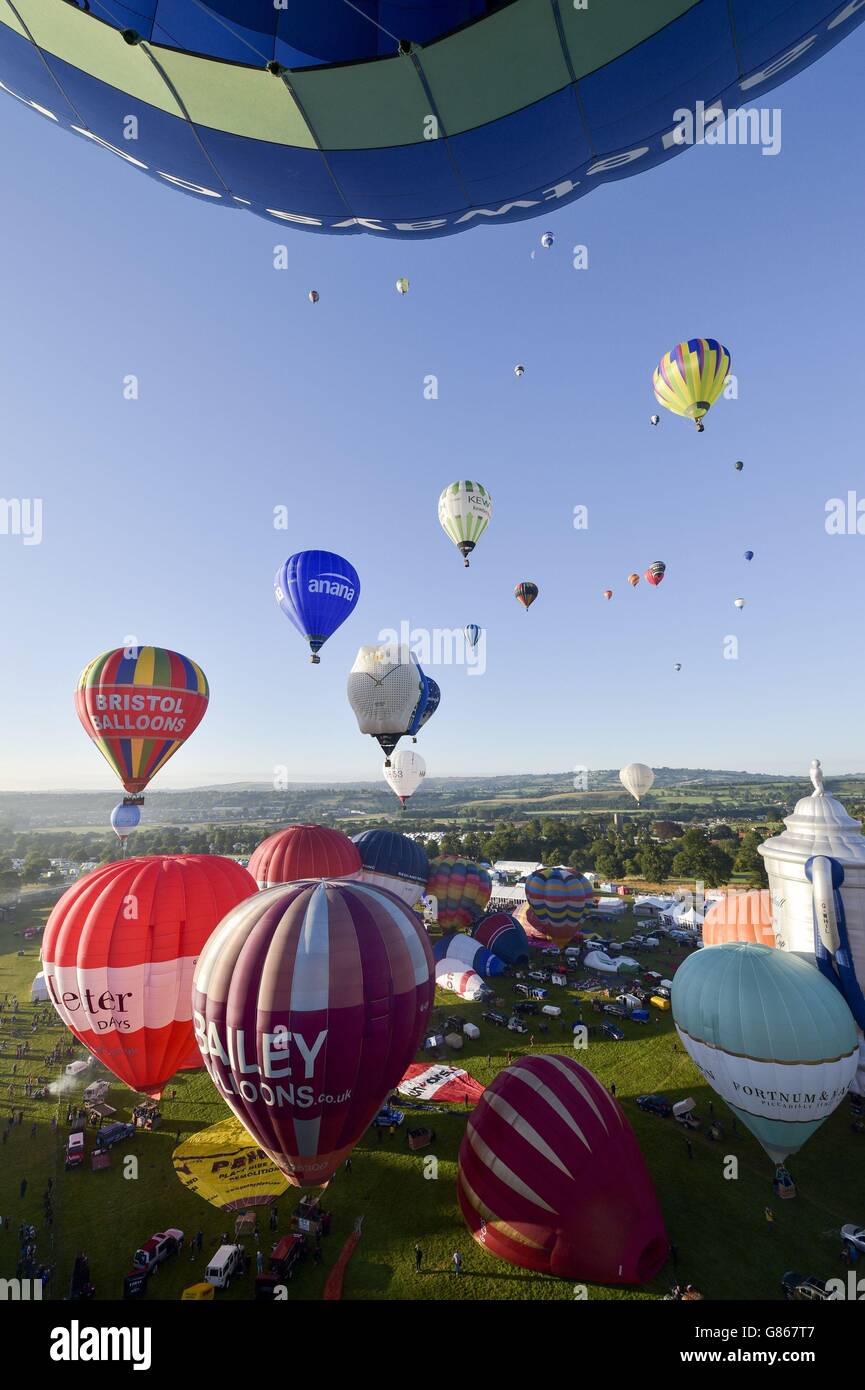 Hot air balloons lift off during the first mass ascent at the 37th