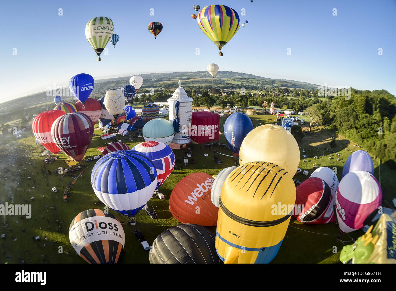 Hot air balloons lift off during the first mass ascent at the 37th