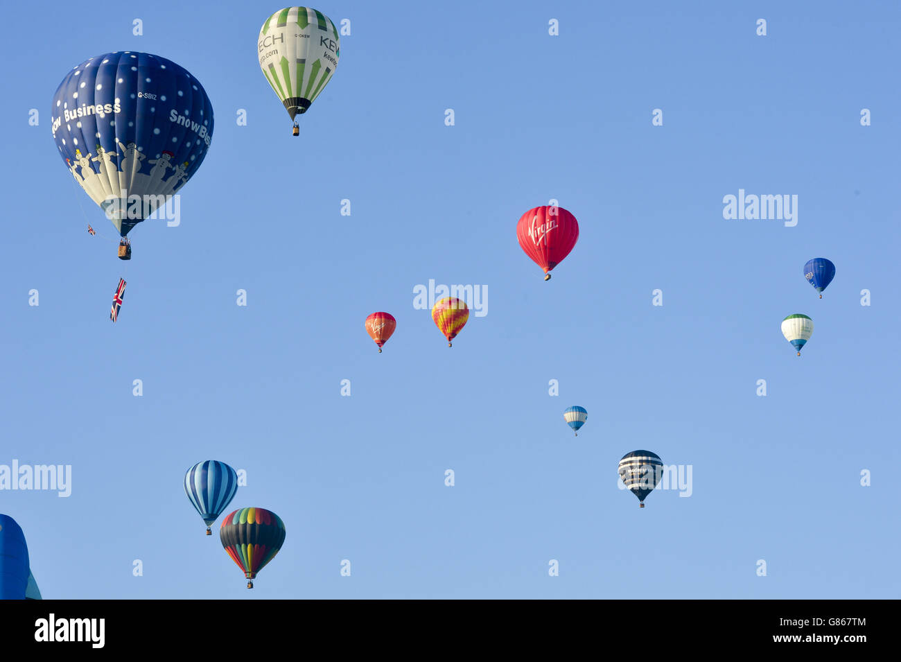 Hot air balloons lift off during the first mass ascent at the 37th