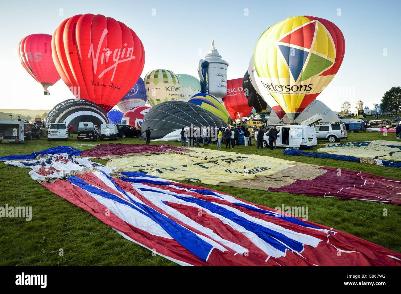 Hot air balloons lift off during the first mass ascent at the 37th