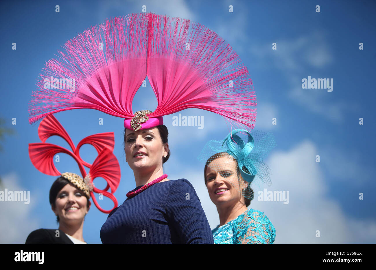 Milliner Caithriona King (centre), from Curafin, displays some of her creations with Suzanne Burke (left), from Athlone and Cathy Dillon, from Athenry during Ladies' day at the Dublin Horse show taking place at the RDS in Dublin. Stock Photo