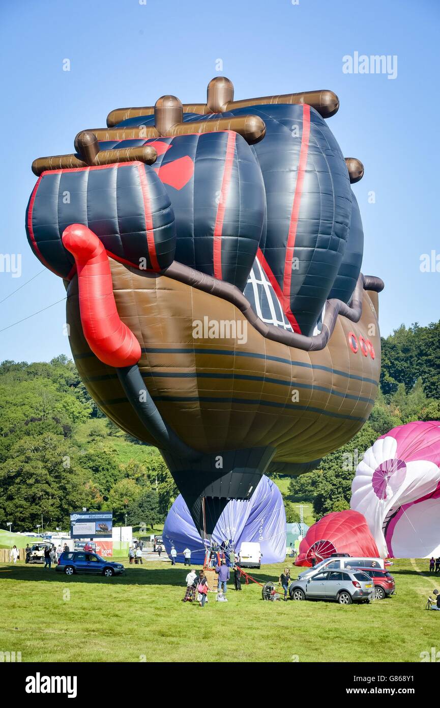 The worlds largest hot air balloon shape is inflated and tethered at the 37th Bristol International Balloon Fiesta at Ashton Court Estate, Bristol, which sees balloon pilots and crews from all over the world descend on the city to fly across the Somerset and South West skies of the UK. Stock Photo