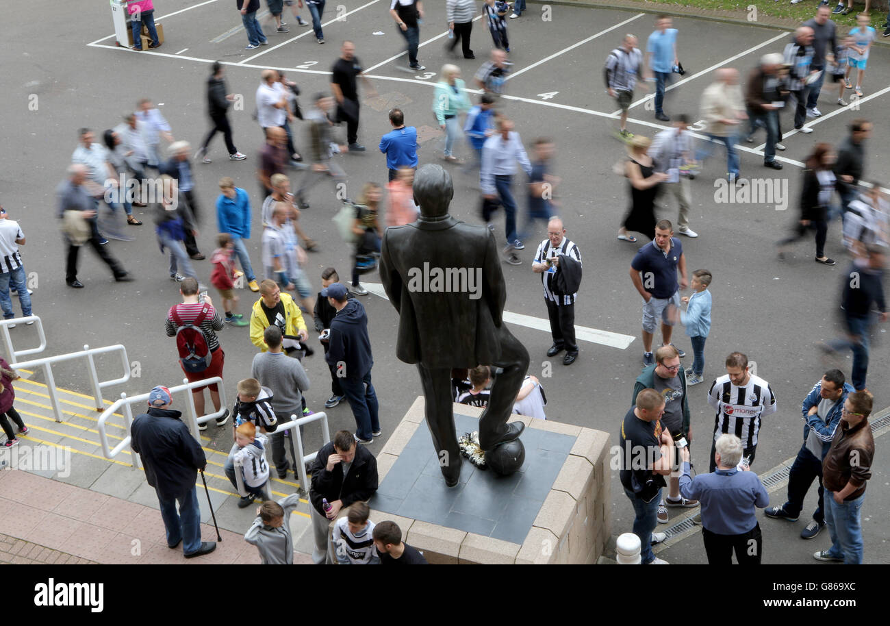 Fans walk into the Newcastle United's St. James' Park Football Stadium before the Barclays Premier League match at St James' Park, Newcastle. Stock Photo
