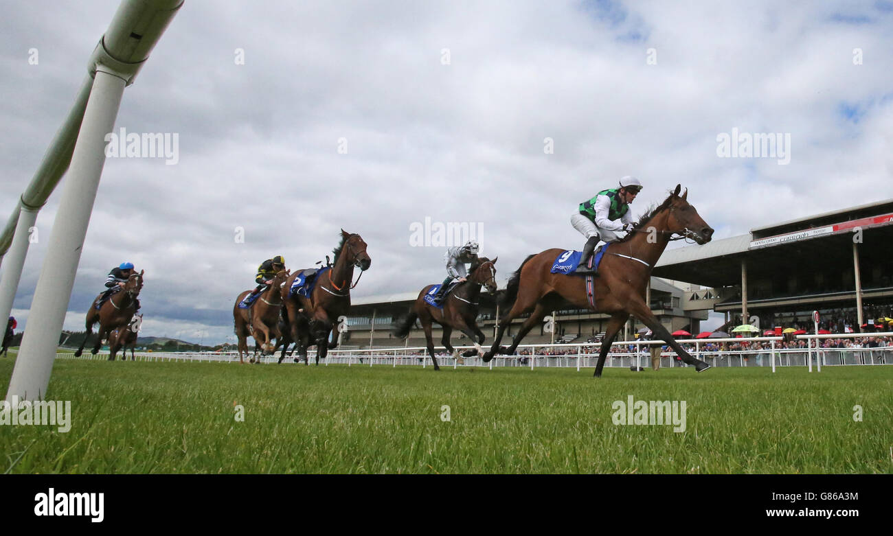 How High The Moon ridden by Seamie Heffernan wins The Loder European Breeders Fund Fillies Race during the Keeneland Family Raceday meeting at The Curragh Racecourse, Kildare. Picture date: Sunday August 9, 2015. See PA story RACING Curragh. Photo credit should read Niall Carson/PA Wire. Stock Photo