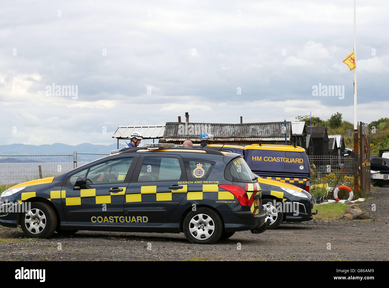 Flags at half mast hang at the gates of East Wemyss angling club after
