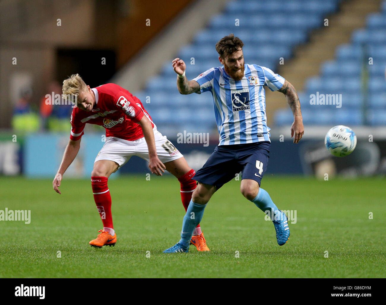 Crewe Alexandra's Adam King (left) and Coventry City's Romain Vincelot battle for the ball during the Sky Bet League One match at the Ricoh Arena, Coventry. Stock Photo