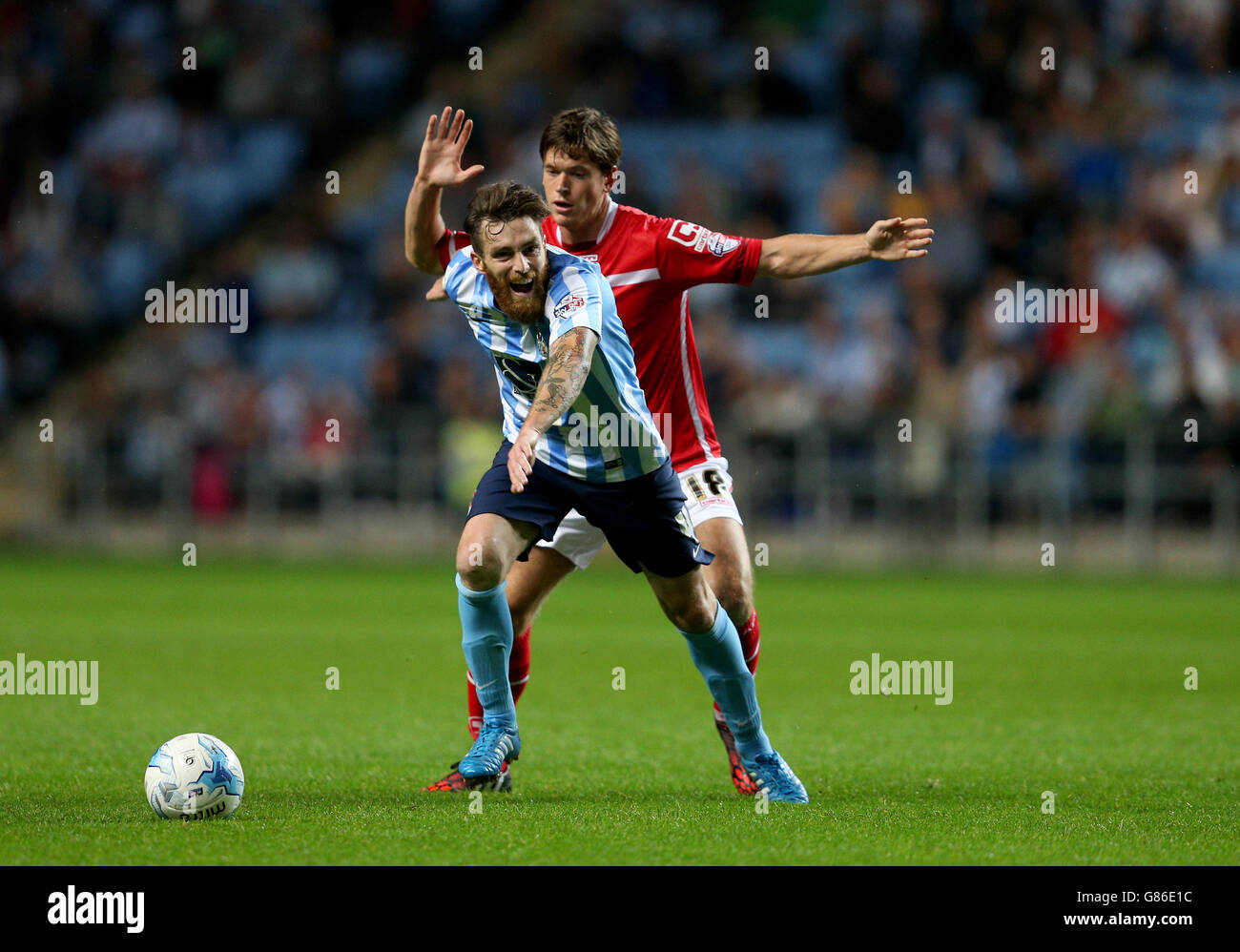 Coventry City's Romain Vincelot (left) and Crewe Alexandra's Billy Bingham battle for the ball during the Sky Bet League One match at the Ricoh Arena, Coventry. Stock Photo