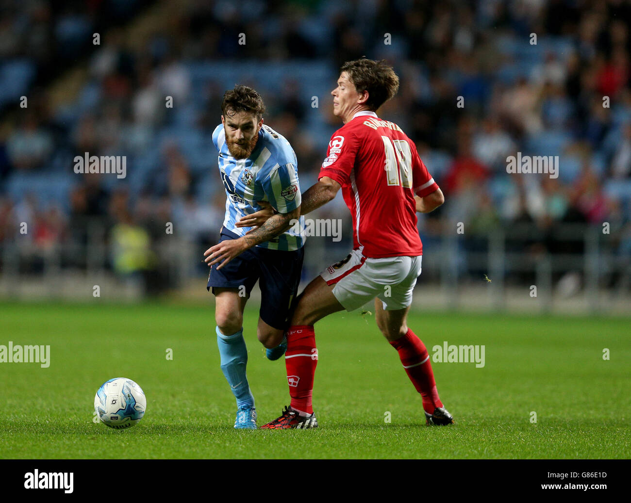 Coventry City's Romain Vincelot (left) and Crewe Alexandra's Billy Bingham battle for the ball during the Sky Bet League One match at the Ricoh Arena, Coventry. Stock Photo