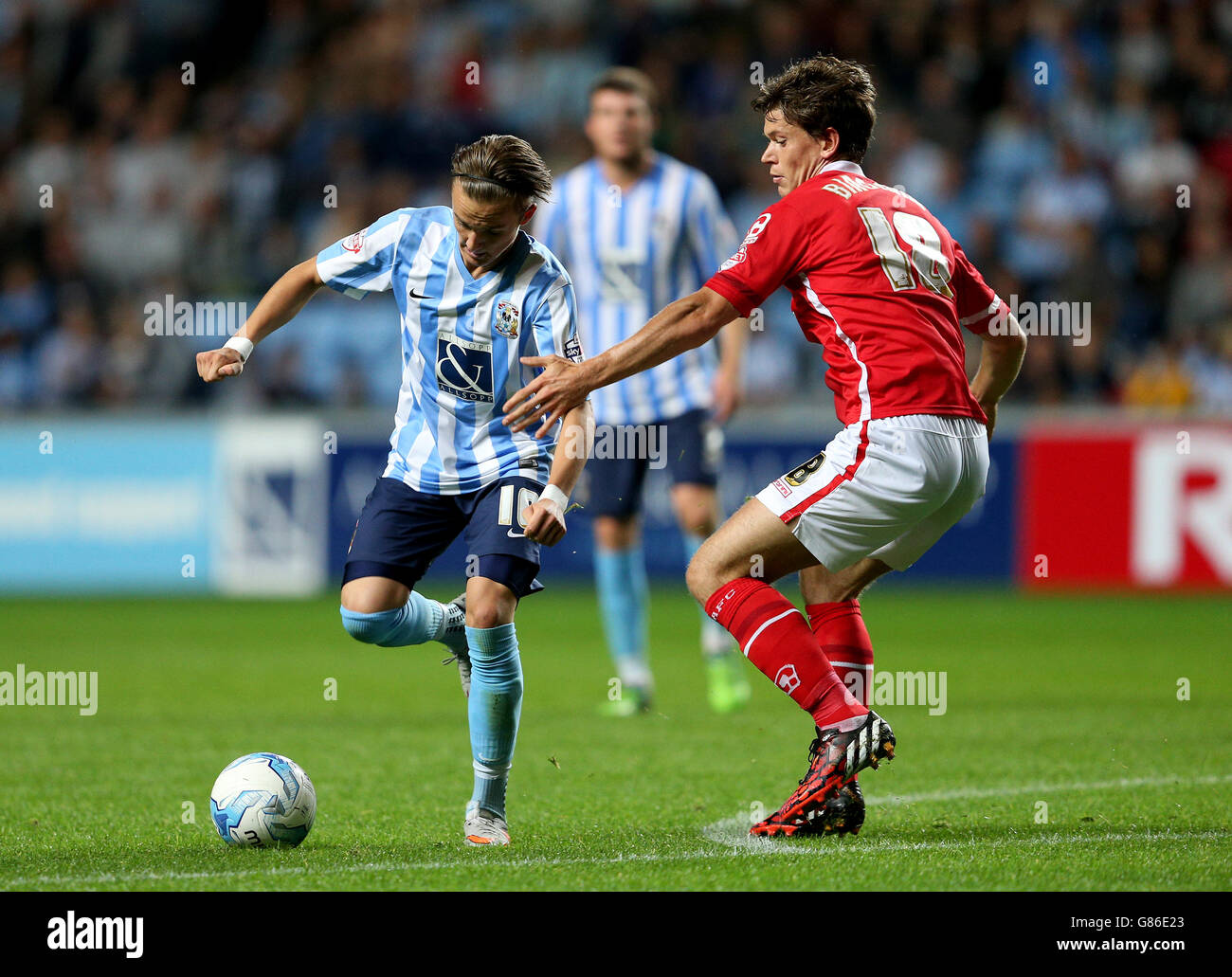 Coventry City's James Maddison (left) and Crewe Alexandra's Billy Bingham battle for the ball during the Sky Bet League One match at the Ricoh Arena, Coventry. Stock Photo