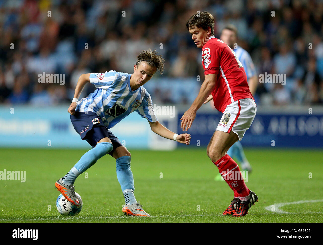 Coventry City's James Maddison (left) and Crewe Alexandra's Billy Bingham battle for the ball during the Sky Bet League One match at the Ricoh Arena, Coventry. Stock Photo