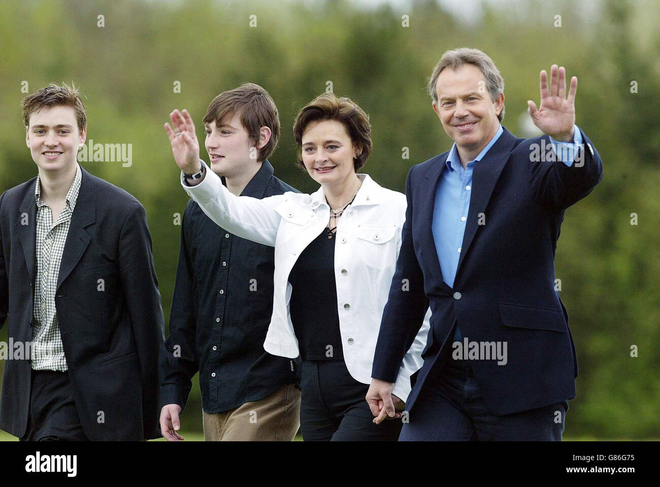 Tony Blair and his wife, Cherie, walk, with sons Euan (left) and Nicky