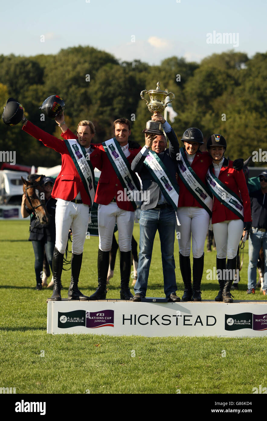 The Belguim team celebrate winning the Furusiyya FEI Nations Cup of Great Britain presented by Longines during day four of the Longines Royal International Horse Show at Hickstead, West Sussex. Stock Photo