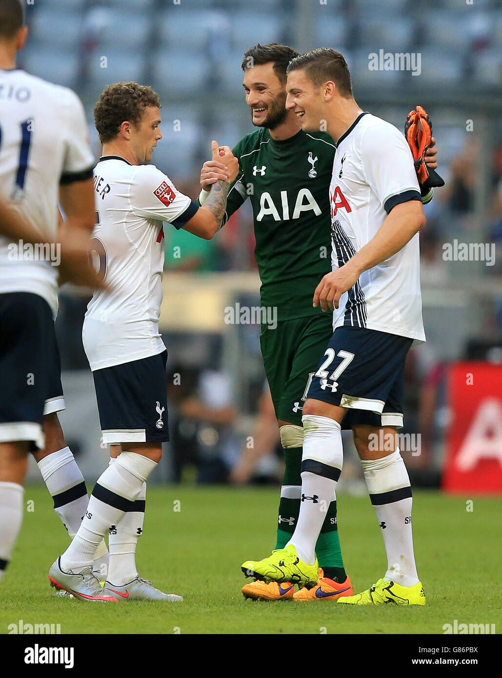 Tottenham Hotspur' goalkeeper Hugo Lloris (centre) shakes hands with team-mates Kieran Trippier (left) and Kevin Wimmer afer the game Stock Photo